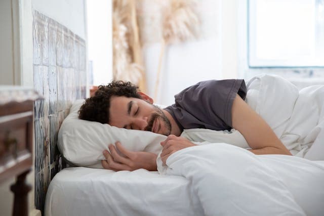 A man sleeping in bed
